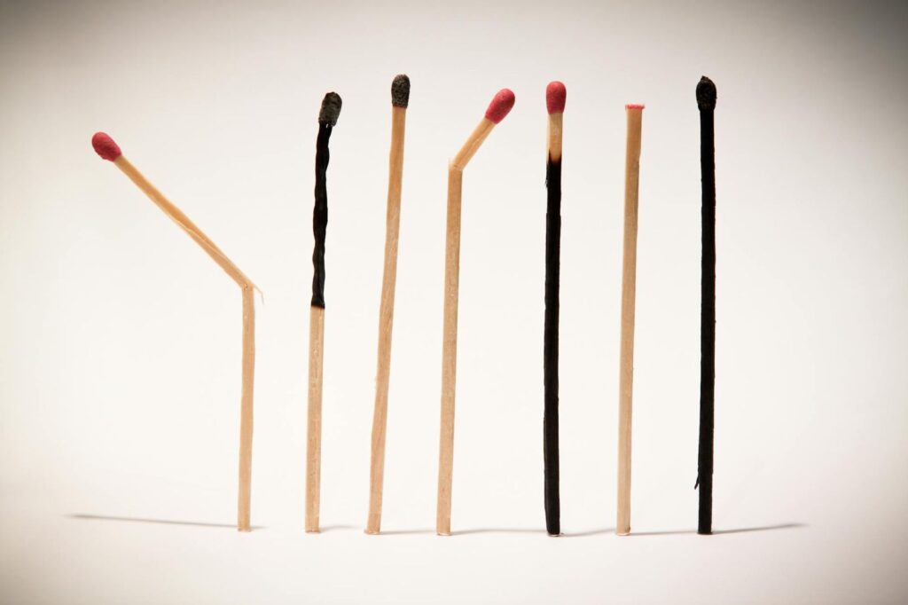 Creative display of matches in various stages of burning, symbolizing transformation.